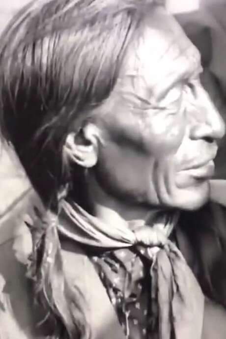 Buffalo Bill and Chief Iron Tail Swap Yarns in the Sign Language